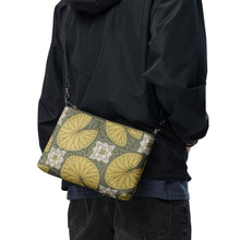 Load image into Gallery viewer, Melodia Gallery Water Lilies Art Nouveau crossbody bag in faux leather with yellow lily pads and white flowers on a green background.

