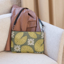 Load image into Gallery viewer, Melodia Gallery Water Lilies Art Nouveau crossbody bag in faux leather with yellow lily pads and floral motifs on a gray background.
