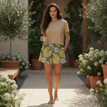 Load image into Gallery viewer, Melodia Gallery Water Lily Unisex Cotton Shorts with Art Nouveau pattern, featuring yellow lily pads and white flowers on a grey background.
